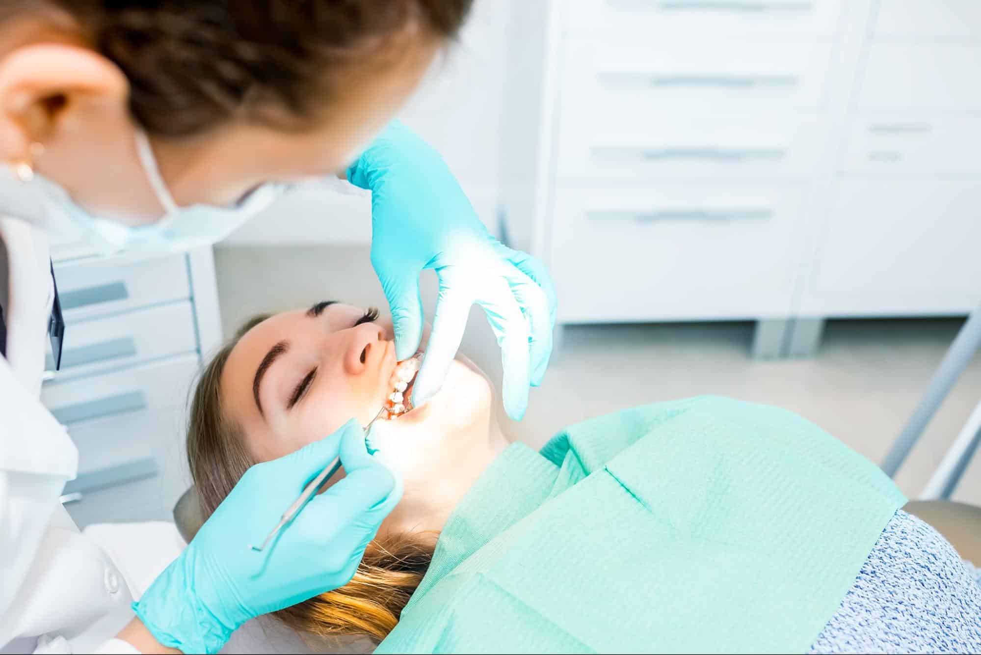 Orthodontist Adjusting Braces For Patient Near Matthews Nc